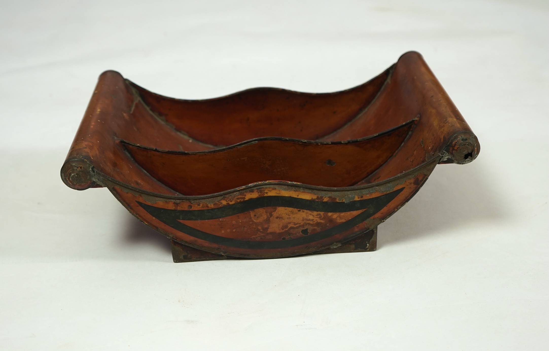 A pair of early 19th century Dutch japanned pewter chest urns and covers, and a tole ware cheese coaster